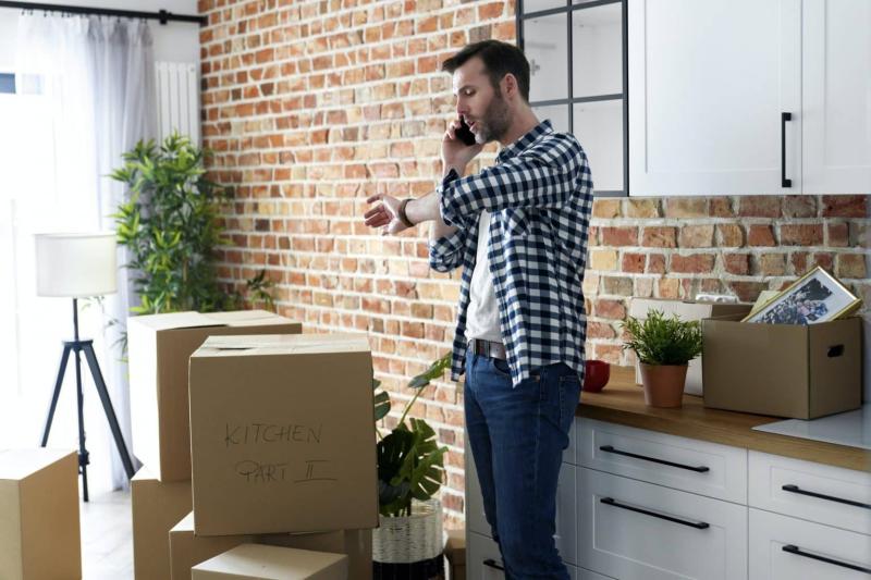 displeased-man-calling-for-help-with-moving-house