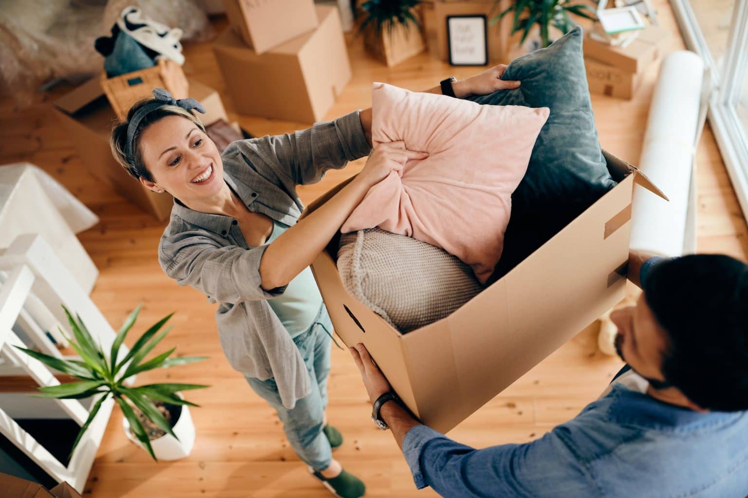 above-view-of-happy-couple-moving-into-their-new-home